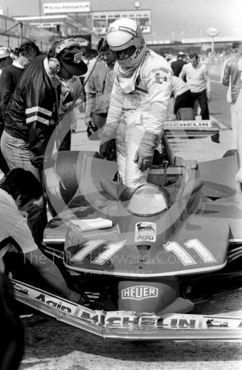 Jody Schecker in the pit lane with a bent front aerofoil on his Ferrari 312T4 V12 during practice, Silverstone, British Grand Prix 1979.
