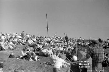 Spectators enjoy the sunshine, Mallory Park, March 1964.
