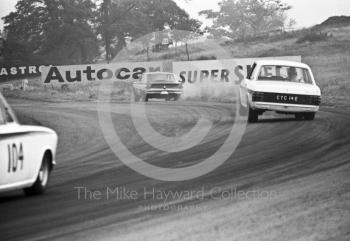 Graham Hill, Team Lotus Cortina, CTC 14E, chases a Ford Falcon out of Cascades followed by the Lotus Cortina of William Vaughan, Oulton Park Gold Cup meeting, 1967.
