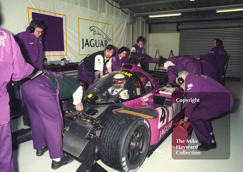 Ross Brawn looks on as mechanics work on Teo Fabi's Silk Cut Jaguar XJR-14 Cosworth V12, Castrol BRDC Empire Trophy, World Sports Car Championship, Silverstone, 1991.
