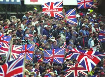 Flag waving spectators at Copse Corner, British Grand Prix, Silverstone, 1992
