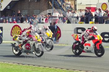 Wayne Rainey (1), Marlboro Team Roberts Yamaha, Kevin Schwantz (34), Team Lucky Strike Suzuki, and Mick Doohan (3), Rothmans Honda, Donington Park, British Grand Prix 1991.