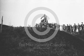 Against the sky, motorcycle scramble at Spout Farm, Malinslee, Telford, Shropshire between 1962-1965