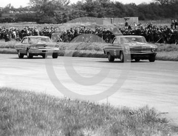 In the lead is Sir John Whitmore, Alan Mann Racing Ford Falcon, Silverstone International Trophy meeting 1966. Following is Brian Muir, Willment Ford Galaxie.
