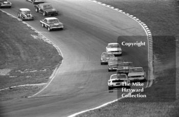 Jack Oliver, Ford Mustang, leads Graham Hill, Team Lotus Ford Cortina, on the first lap at Paddock Bend, British Touring Car Championship Race, Guards International meeting, Brands Hatch 1967.
