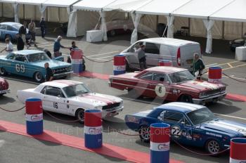 Neil Cunningham, Ford Mustang, Simon Miller, Ford Mustang, Roger Wills, Mercury Comet Cyclone, and David Franklin, Ford Galaxie, in the paddock before practice for the HSCC Big Engine Touring race, Silverstone Classic, 2010