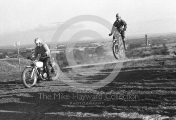 Soaring over the landscape, motorcycle scramble at Spout Farm, Malinslee, Telford, Shropshire between 1962-1965
