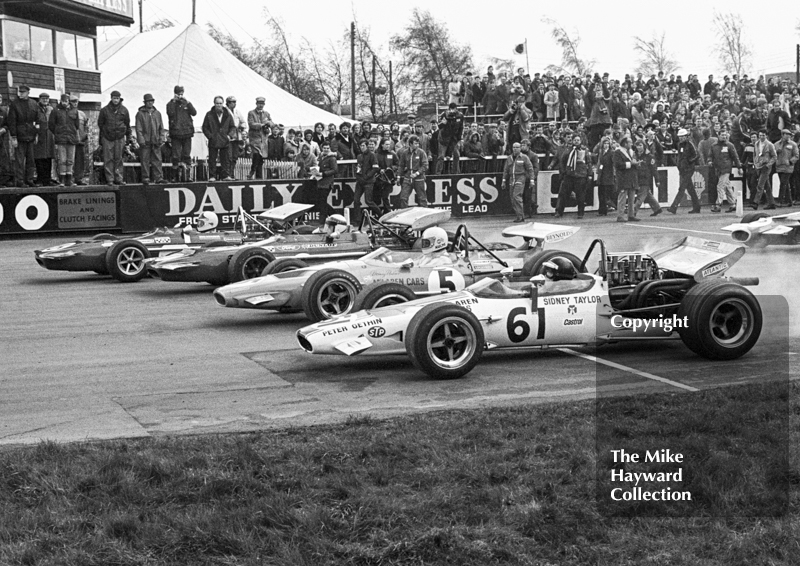 Chris Amon, works March Ford 701; Jackie Stewart, Tyrrell March Ford 701; Denny Hulme, McLaren Ford M14A; and Peter Gethin, Sid Taylor McLaren M10B Chevrolet; Silverstone International Trophy 1970.