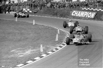 Graham Hill, Lotus 49, leads Chris Amon, Ferrari 312, Denny Hulme, McLaren M7A and Jacky Ickx, Ferrari 312, Brands Hatch, 1968 Race of Champions.
