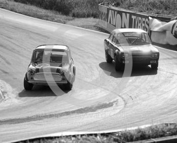 Gordon Spice, Britax Cooper Downton Mini Cooper S, and Chris Craft, Team Broadspeed Ford Escort (XOO 341F), Shaw's Hairpin, British Saloon Car Championship race, BRSCC Guards 4,000 Guineas International meeting, Mallory Park, 1969.
