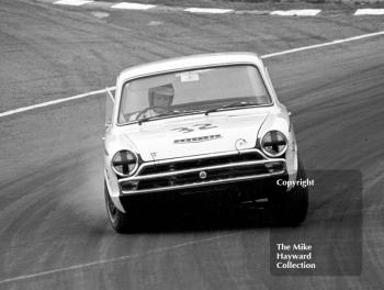 Tony Dean, Lotus Cortina, at South Bank Bend, British Saloon Car Championship race, 1968 Grand Prix meeting, Brands Hatch.
