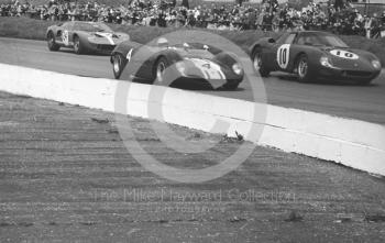 Tony Dean, Brabham BT8, Bob Bondurant, Ferrari 250LM and Eric Liddell, Ford GT40 at Copse Corner, Silverstone International Trophy sports car race, 1966
