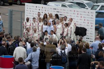 Sir Stirling Moss poses with celebrity drivers, Silverstone Classic, 2010