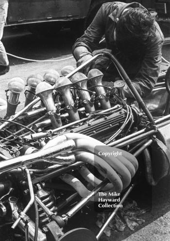 Mechanic at work on a Formula One Repco Brabham engine in the paddock, Brands Hatch, 1968 British Grand Prix.
