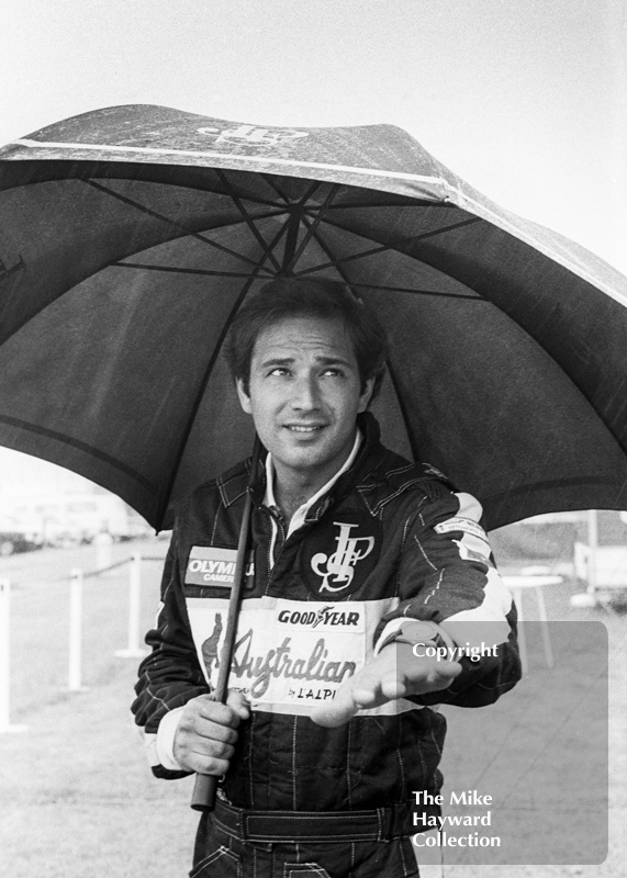 Elio de Angelis, JPS Lotus 97T, in the paddock during a wet practice session, Silverstone, 1985 British Grand Prix.