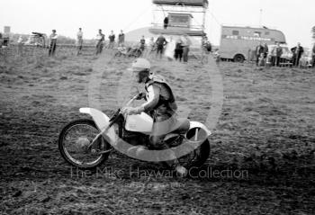 A rider passes a TV camera, motorcycle scramble at Spout Farm, Malinslee, Telford, Shropshire between 1962-1965