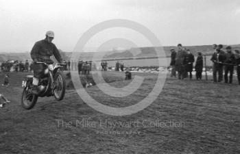 Airborne rider, motorcycle scramble at Spout Farm, Malinslee, Telford, Shropshire between 1962-1965