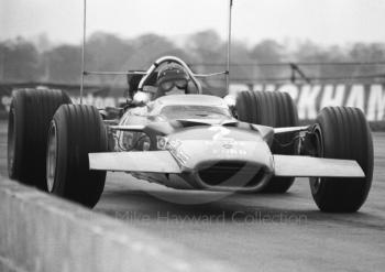 Jochen Rindt, Gold Leaf Team Lotus Ford 49B R9, at Copse Corner, Silverstone, International Trophy 1969.
