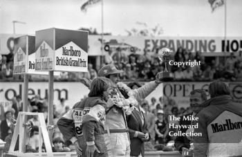 John Watson lifts the trophy, Silverstone, 1981 British Grand Prix.
