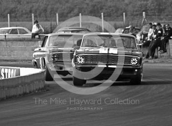 Brian Muir, W J Shaw Ford Falcon, and David Hobbs, Malcolm Gartlan Ford Falcon, at Becketts Corner, Silverstone Martini International Trophy 1968.
