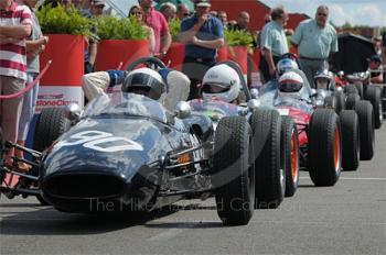 Emanuele Benedini, 1963 Brabham BT6, leads the queue in the paddock ahead of the Colin Chapman Trophy Race for Historic Formula Juniors, Silverstone Classic 2009.