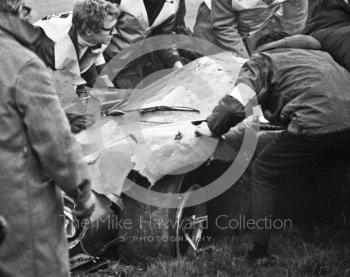 Marshalls with the wreckage of Jo Bonnier's Lola T70 which somersaulted at Bottom Bend, Brands Hatch, BOAC 500 1969.
