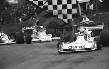 Alan Jones, Durex Surtees TS19, leads James Hunt, Marlboro McLaren M23, into Druids Hairpin at the Race of Champions, Brands Hatch, 1976.

