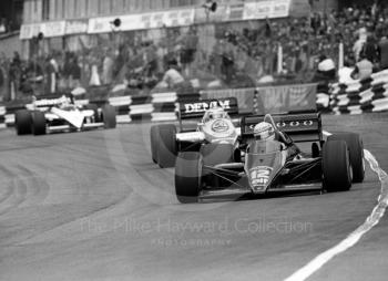 Ayrton Senna, JPS Lotus 97T-4, leads Keke Rosberg, Williams FW10/7, through Paddock Bend, 1985 European Grand Prix, Brands Hatch
