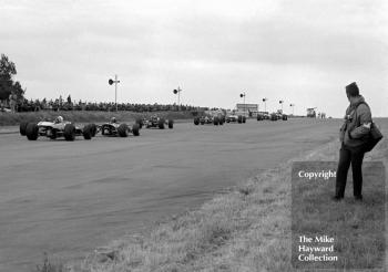 A line of Formula 3 cars exiting Copse Corner, Silverstone, 1969 British Grand Prix meeting.
