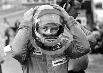 Patrick Depailler puts on his helmet, Brands Hatch, British Grand Prix 1974.
