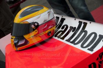 Helmet of Christophe D'Ansembourg on the rear wing of his Formula One McLaren M26, F1 Grand Prix Masters, Silverstone Classic, 2010