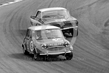 John Wales, Mick Clare Mini Cooper S (MC 58), leads Roy Pierpoint, Ford Falcon Sprint, through Bottom Bend, British Saloon Car Championship race, 1968 Grand Prix meeting, Brands Hatch.
