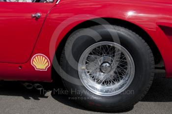 Chrome wire wheel on a Maserati sports car at Silverstone Classic, 2010