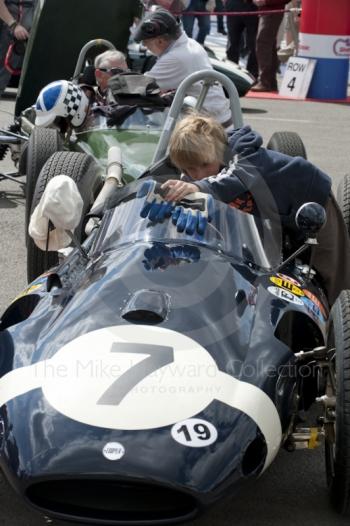 A young boy dreams of being a racing driver looking at the Cooper T51 of Nick Wigley, Silverstone Classic, 2010