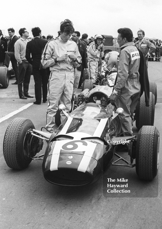 Jochen Rindt, Cooper Maserati V12 T81, and team mate Richie Ginther on the grid before the start of the Silverstone International Trophy, 1966.

