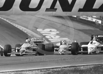 Nigel Mansell, Williams Honda; Nelson Piquet, Williams Honda; and Philippe Streiff, Tyrrell 015, Brands Hatch, British Grand Prix 1986.
