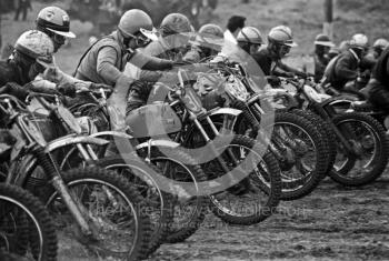 G Holt, BSA 441, and R Wilson, Husqvarna 360, in the centre of a line-up for the start of a solo race, ACU British Scramble Sidecar Drivers Championship meeting, Hawkstone Park, 1969.