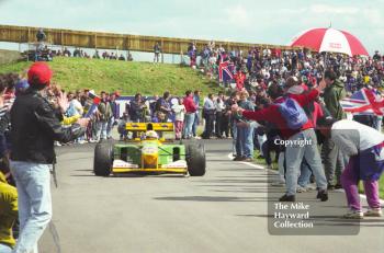 Martin Brundle, Benetton B192, negotiates the crowds after finishing 3rd, 1992 British Grand Prix, Silverstone.
