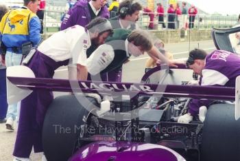 Mechanics working on a Jaguar XJR-11, Shell BDRC Empire Trophy, Round 3 of the World Sports Prototype Championship, Silverstone, 1990.
