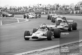 Peter Gethin, Sid Taylor McLaren M10B Chevrolet, leads Graham McRae, McLaren M10B, at Copse Corner, Silverstone, 1970 Martini International Trophy.
