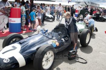 A young boy looks into the cockpit of Nick Wigley's 1959 Cooper T51, Pre-1966 Grand Prix Cars, Silverstone Classic 2010