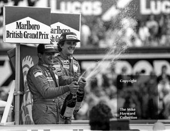 Winner Alain Prost and second-placed Michele Alboreto on the podium, British Grand Prix, Silverstone, 1985
