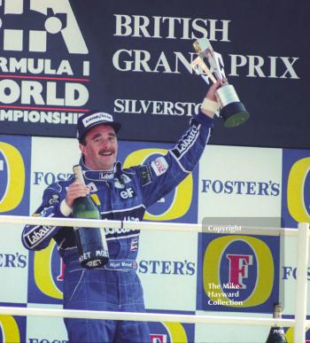 Race winner Nigel Mansell on the podium, Silverstone, British Grand Prix 1991.
