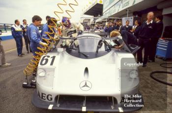 Mechanics work on the Sauber Mercedes C9/88 of Mauro Baldi and Kenny Acheson, Wheatcroft Gold Cup, Donington Park, 1989.
