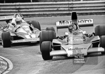 Race winner James Hunt, Marlboro McLaren M23, leads Niki Lauda, Ferrari 312T/2, flat 12 at Druids Hairpin, Race of Champions, Brands Hatch, 1976.

