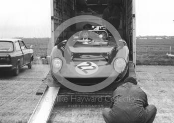 Hugh Dibley's Lola emerges from a horse box in the paddock, Silverstone International Trophy sports car race, 1966
