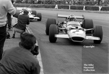 Jochen Rindt, Lotus Cosworth 49B, leads Jackie Stewart, Matra Cosworth MS80, at Copse Corner, Silverstone, 1969 British Grand Prix.
