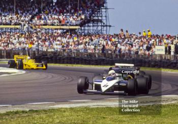 Andrea de Cesaris, Brabham BT56, at Copse Corner before retiring with broken fuel metering unit on lap 28, British Grand Prix, Silverstone, 1987
