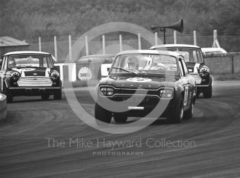 Chris Craft, Broadspeed Ford Escort, leads the Cooper Car Company Mini Cooper S's of John Rhodes and Steve Neal, Becketts Corner, Silverstone Martini International Trophy 1968.