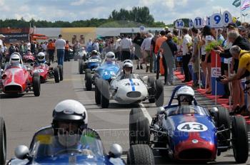 Doug Martin, 1960 Elva 200, followed by Dietrich Merkel, 1960 Britannia, and Gordon Wright, 1959 Stanguellini, in the paddock queue ahead of the Colin Chapman Trophy Race for Historic Formula Juniors, Silverstone Classic 2009.